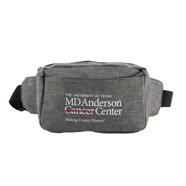 Grey fanny pack with black straps featuring the white MD Anderson logo.